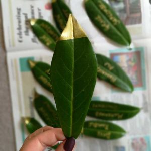 place name card real leaf gold dipped wedding